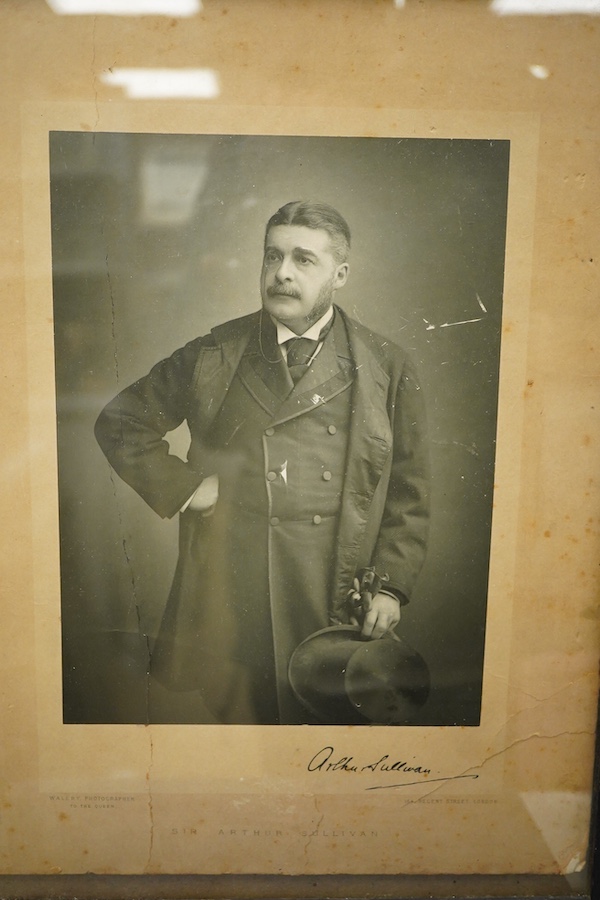 A Gilbert and Sullivan Opera model theatre, with printed card figures from the Mikado, together with a portrait photograph of Sir Arthur Sullivan loosely contained within a stained wood frame, the photograph is unmounted